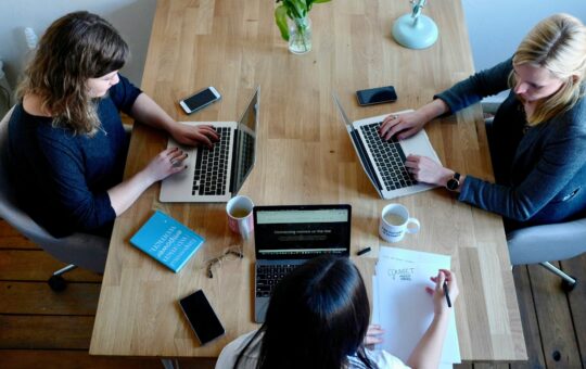 women_working_downloading_content_creators_organizing